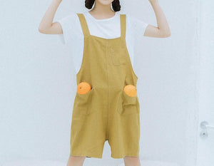 The mustard dungarees overallshorts.
